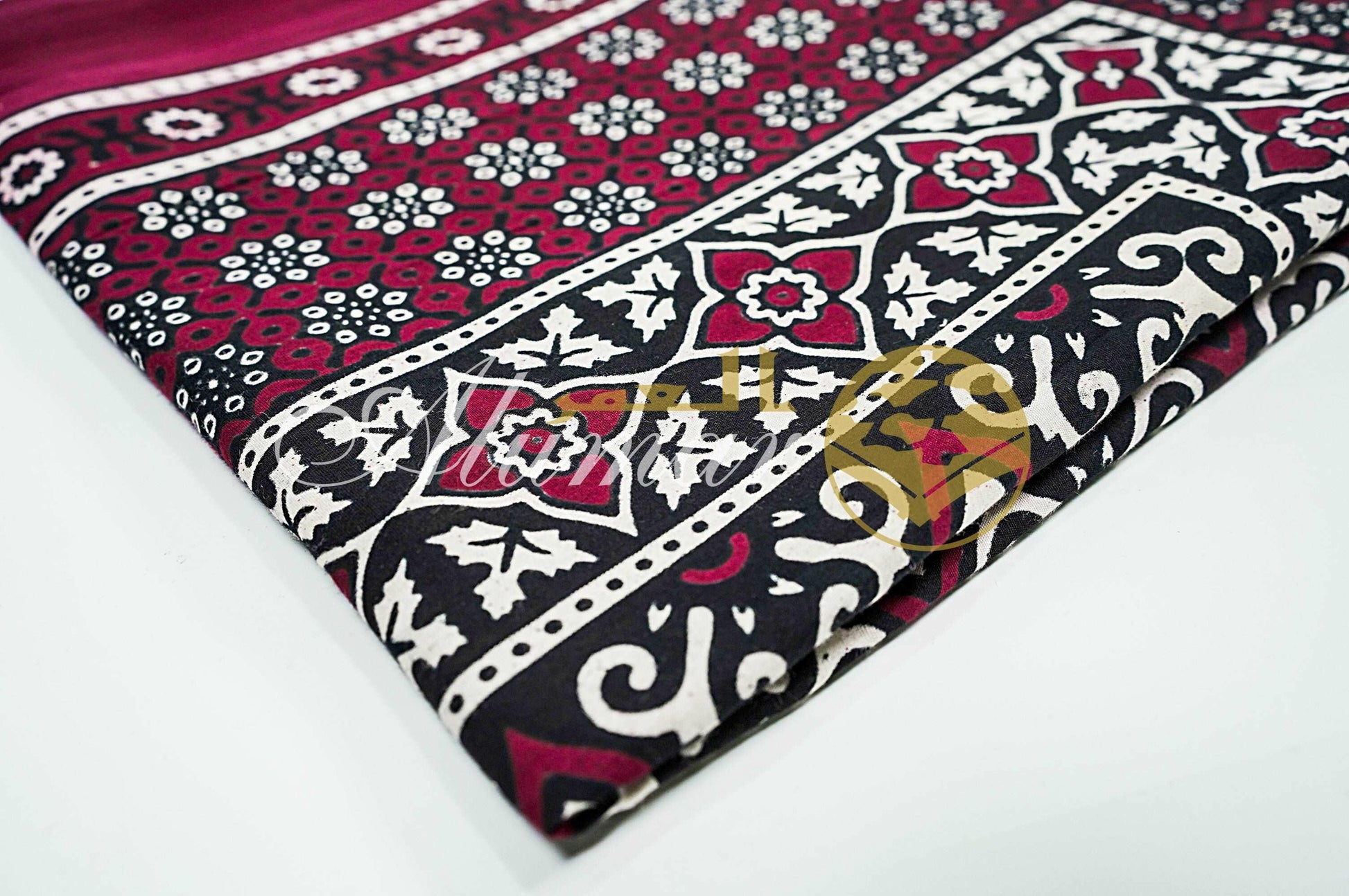 ALFAJR Ajrak shawl draped, showing fabric drape and texture