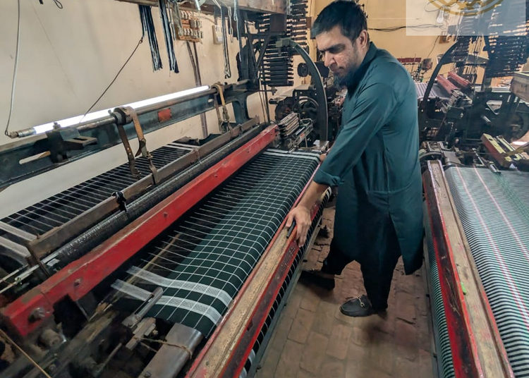 MR FAWAD SURIYA ON HIS POWER LOOM MACHINES
